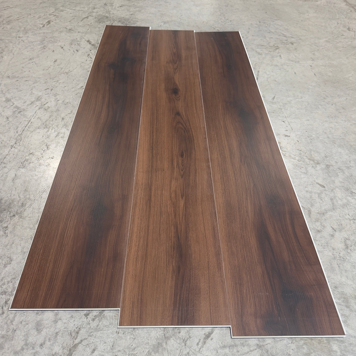 Toucan SPC Flooring 501 - 6MM - Three planks showing deep espresso-walnut grain with dark knots and straight grain lines