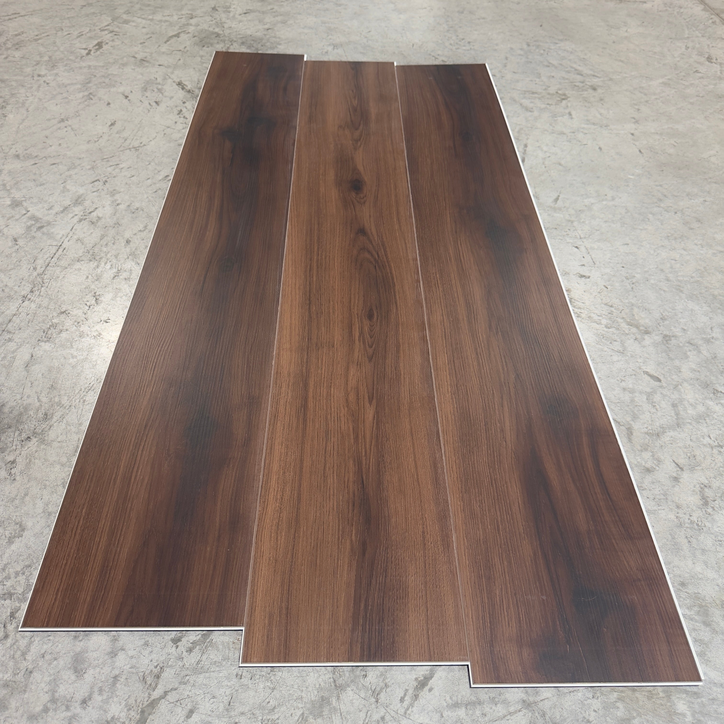 Toucan SPC Flooring 501 - 6MM - Three planks showing deep espresso-walnut grain with dark knots and straight grain lines