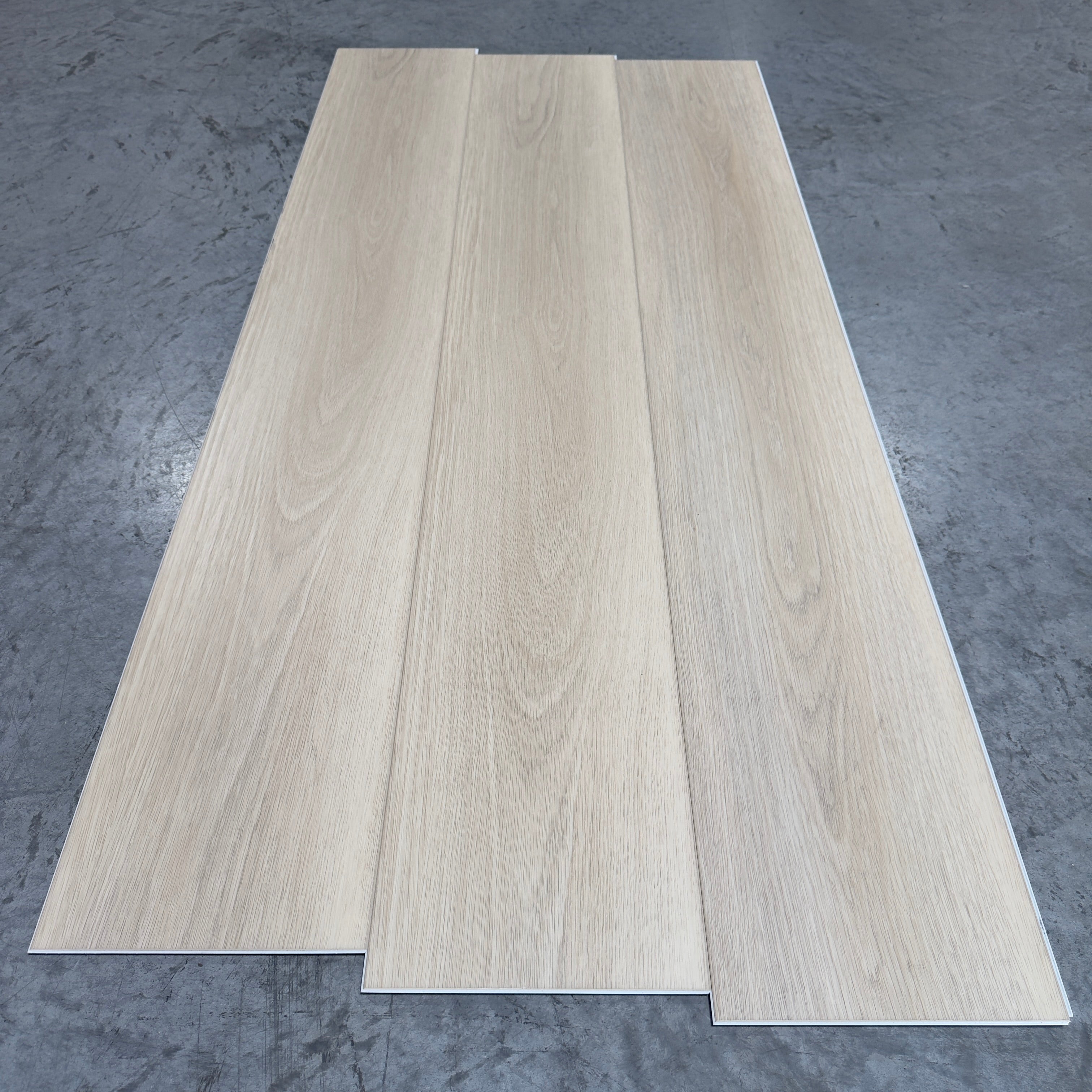 Toucan SPC Flooring 512 - 6MM - Three planks showing soft whitewashed linen oak grain with fine flowing figure