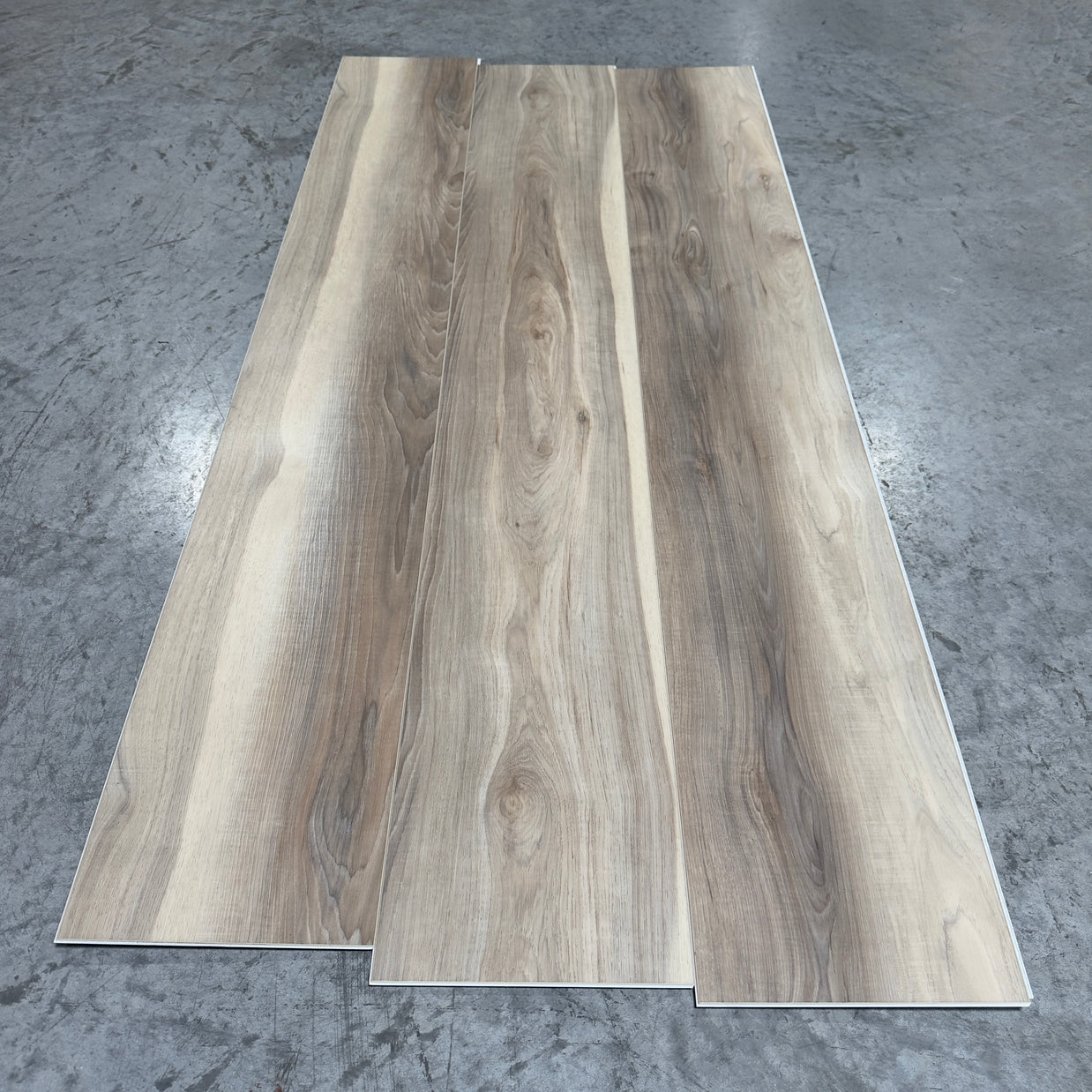 Toucan SPC Flooring 508 - 6MM - Three planks showing warm greige-taupe oak grain with flowing cathedral lines and subtle knots