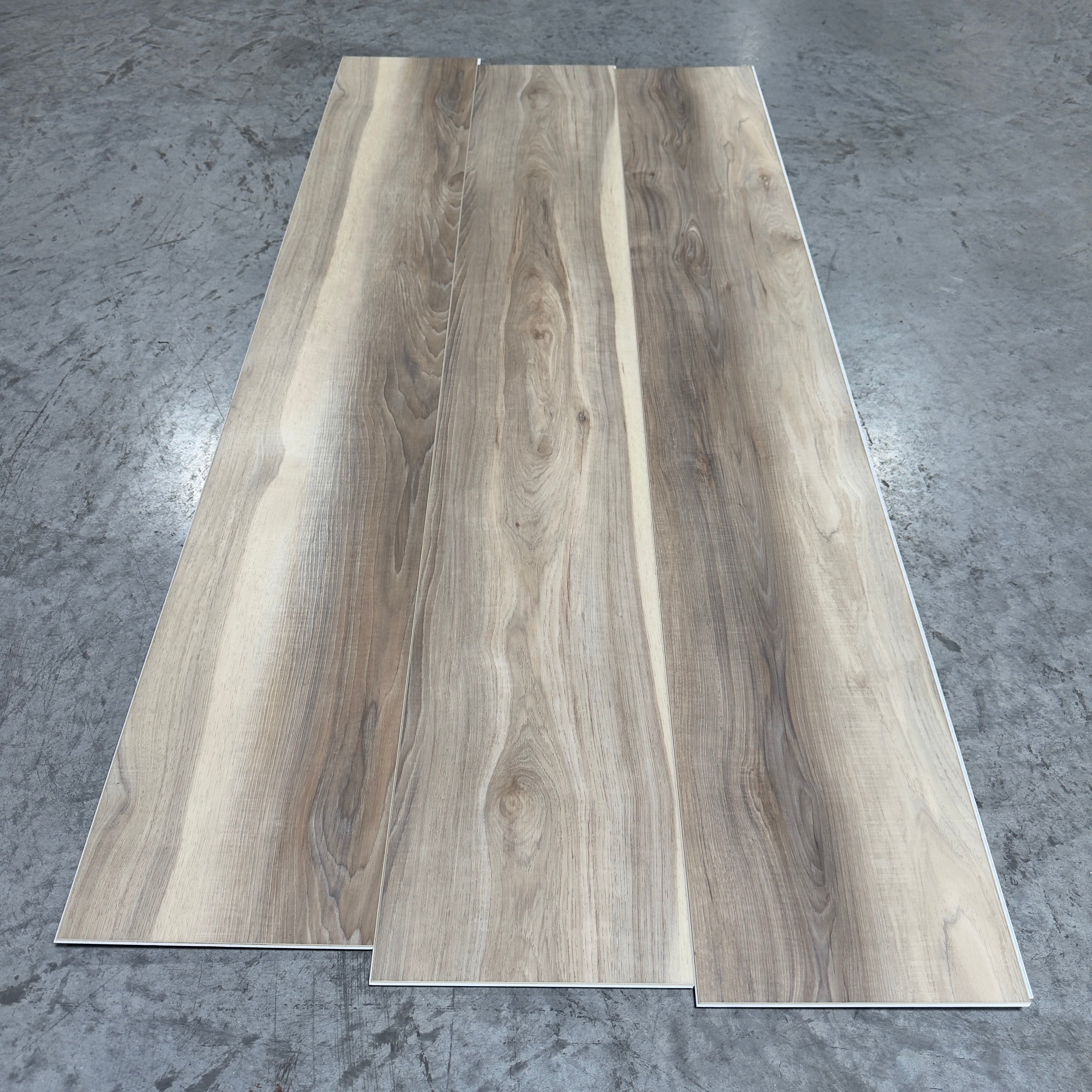 Toucan SPC Flooring 508 - 6MM - Three planks showing warm greige-taupe oak grain with flowing cathedral lines and subtle knots